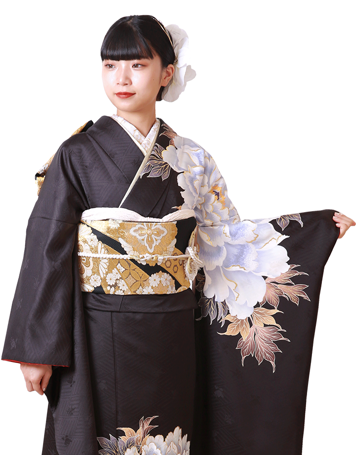 短めの髪型の若い女性。赤と黒を基調とした和装を着て、髪に大きなリボンの髪飾りをつけた七五三やイベント用の記念撮影。